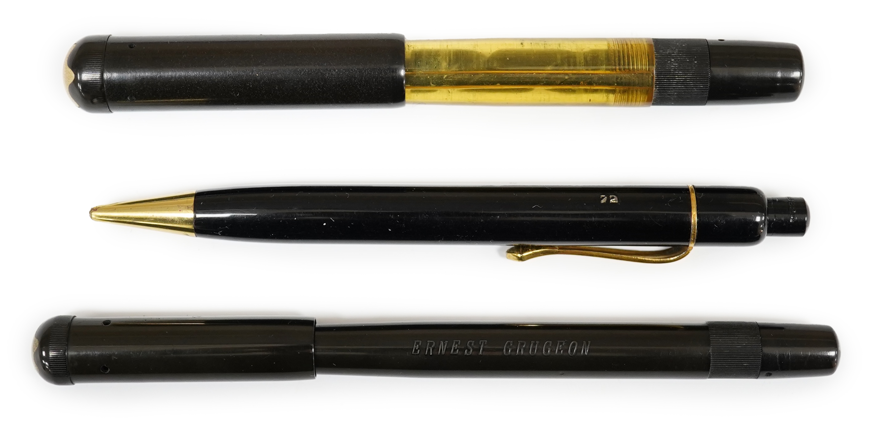 Montblanc safety fountain pens, one with clear celluloid barrel (damaged), a Montblanc pencil and another Montblanc safety pen